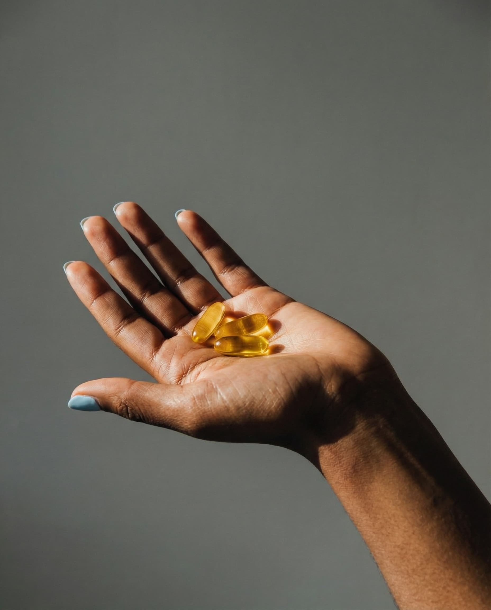 Hand with Gel Capsules